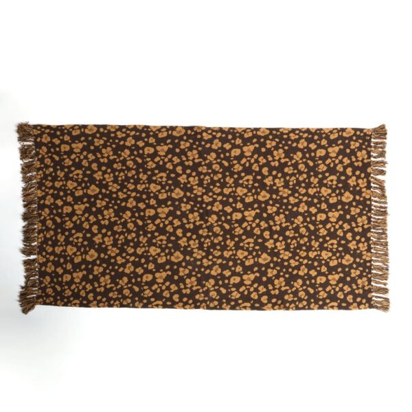 A Cotton Handloom Dhurrie With Leopard Rosettes